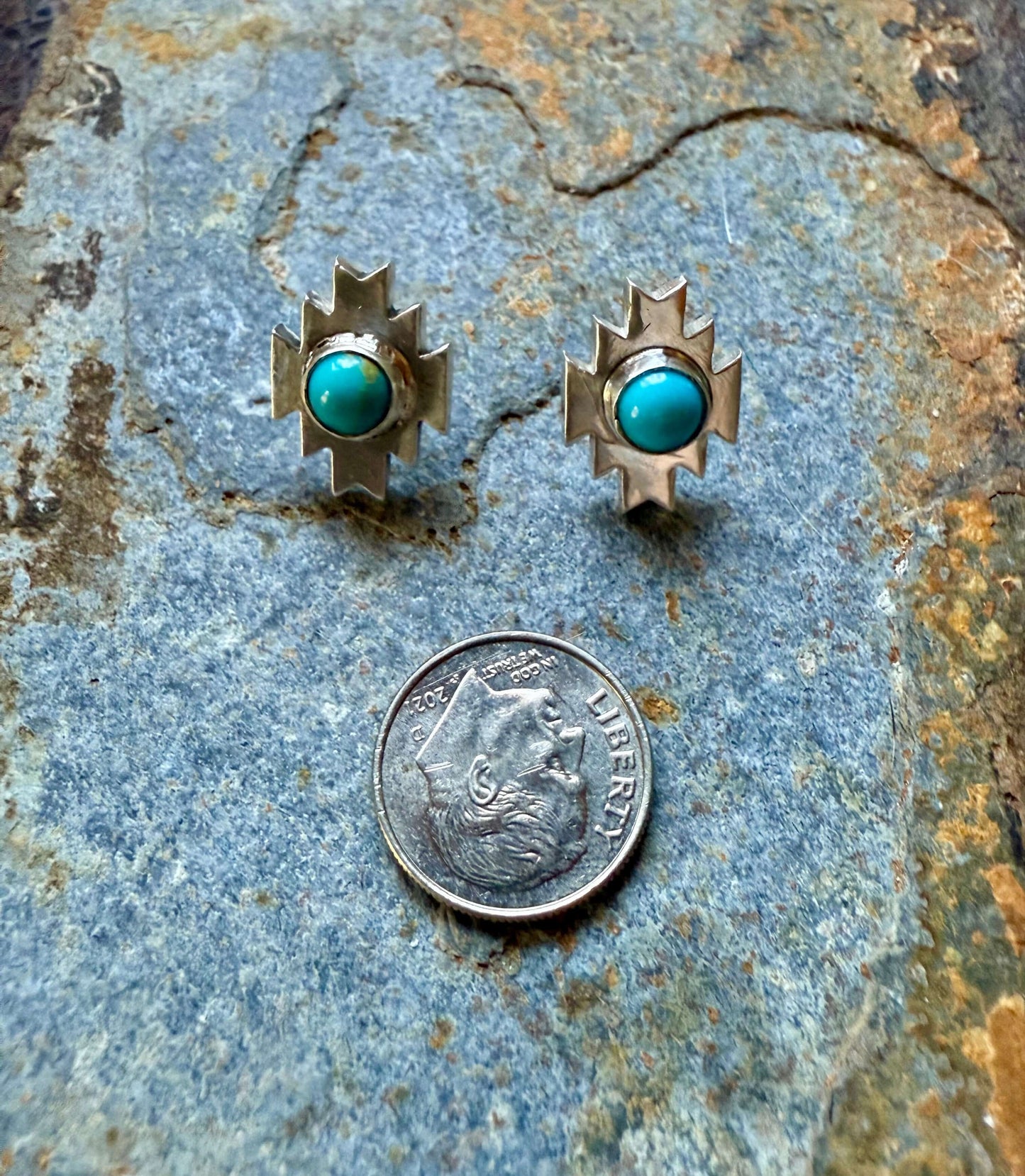 Silver Aztec Post Earrings with Kingman Turquoise displayed alongside a quarter for size reference.