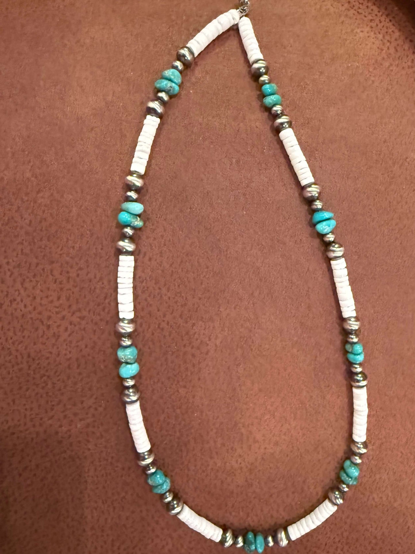 Lone Mountain Turquoise Pearls Necklace | Handmade Elegant Jewelry Necklace with turquoise and silver beads on a brown surface