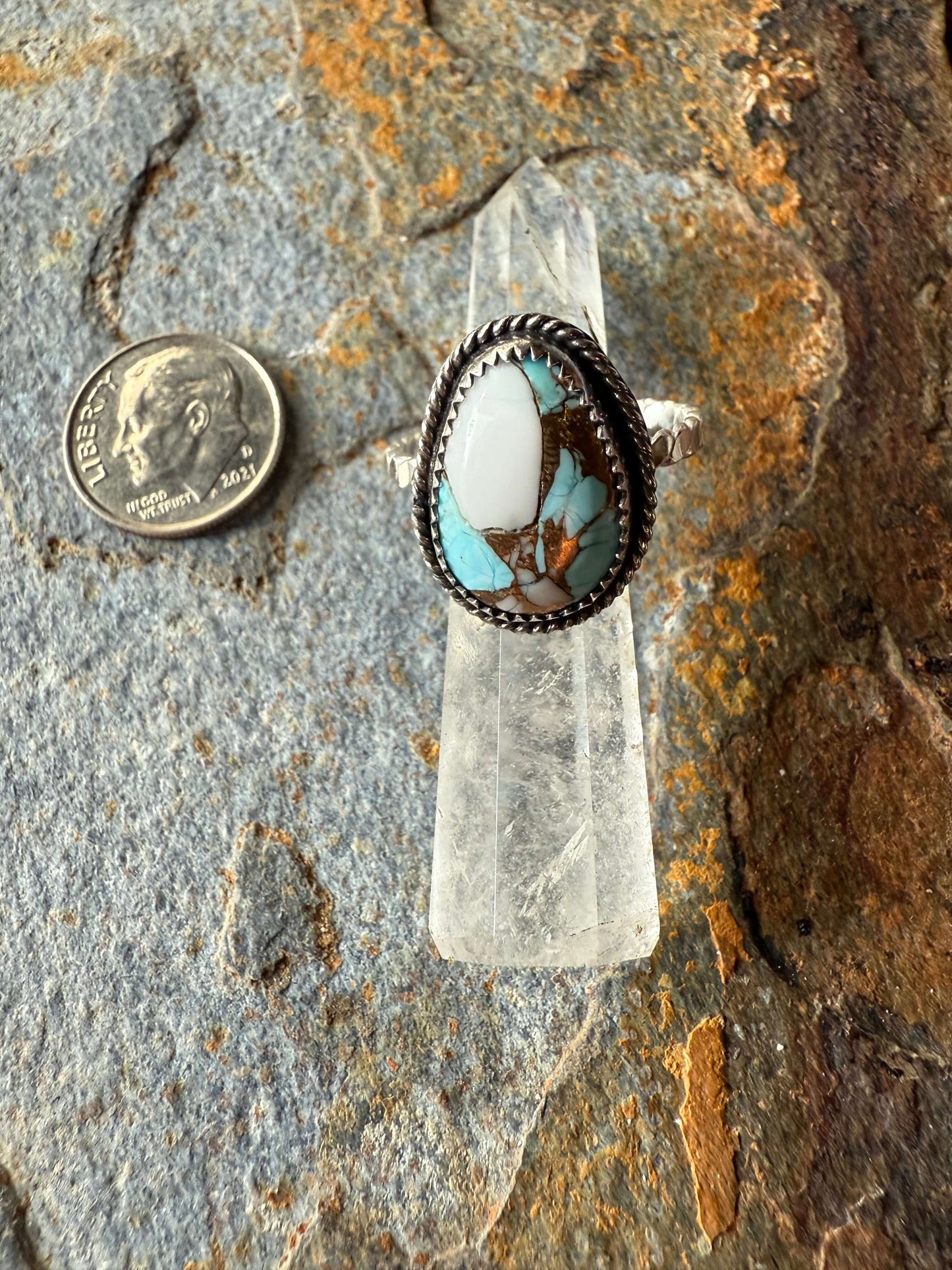 Cotton Candy Dahlia Sterling Silver Ring displayed on a crystal, quarter for size reference.