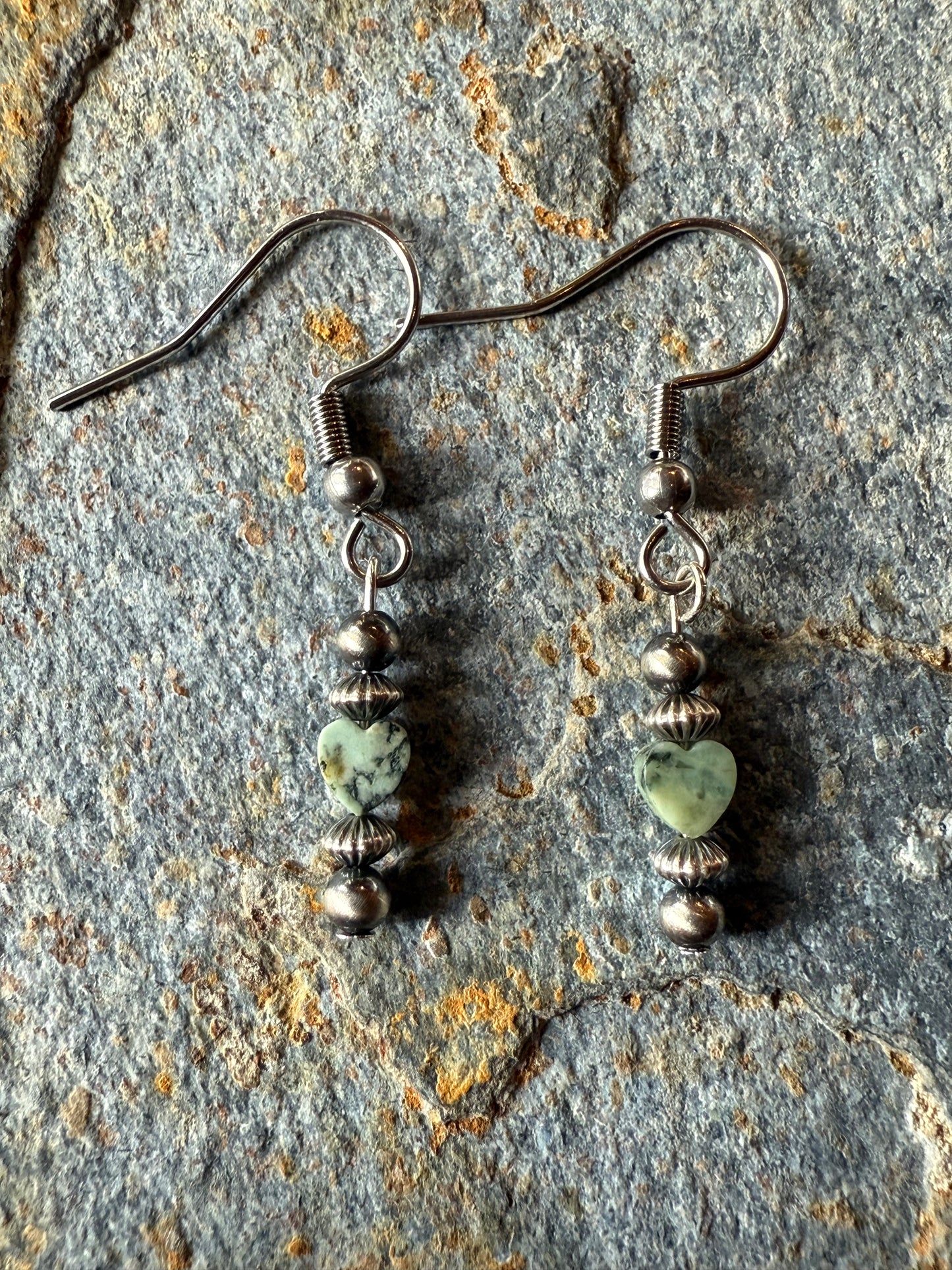 terling silver pearl earrings featuring heart-shaped New Lander turquoise beads with unique veining. Handmade Western jewelry with Southwestern and boho cowgirl charm. Perfect for rodeo fashion and turquoise lovers.
