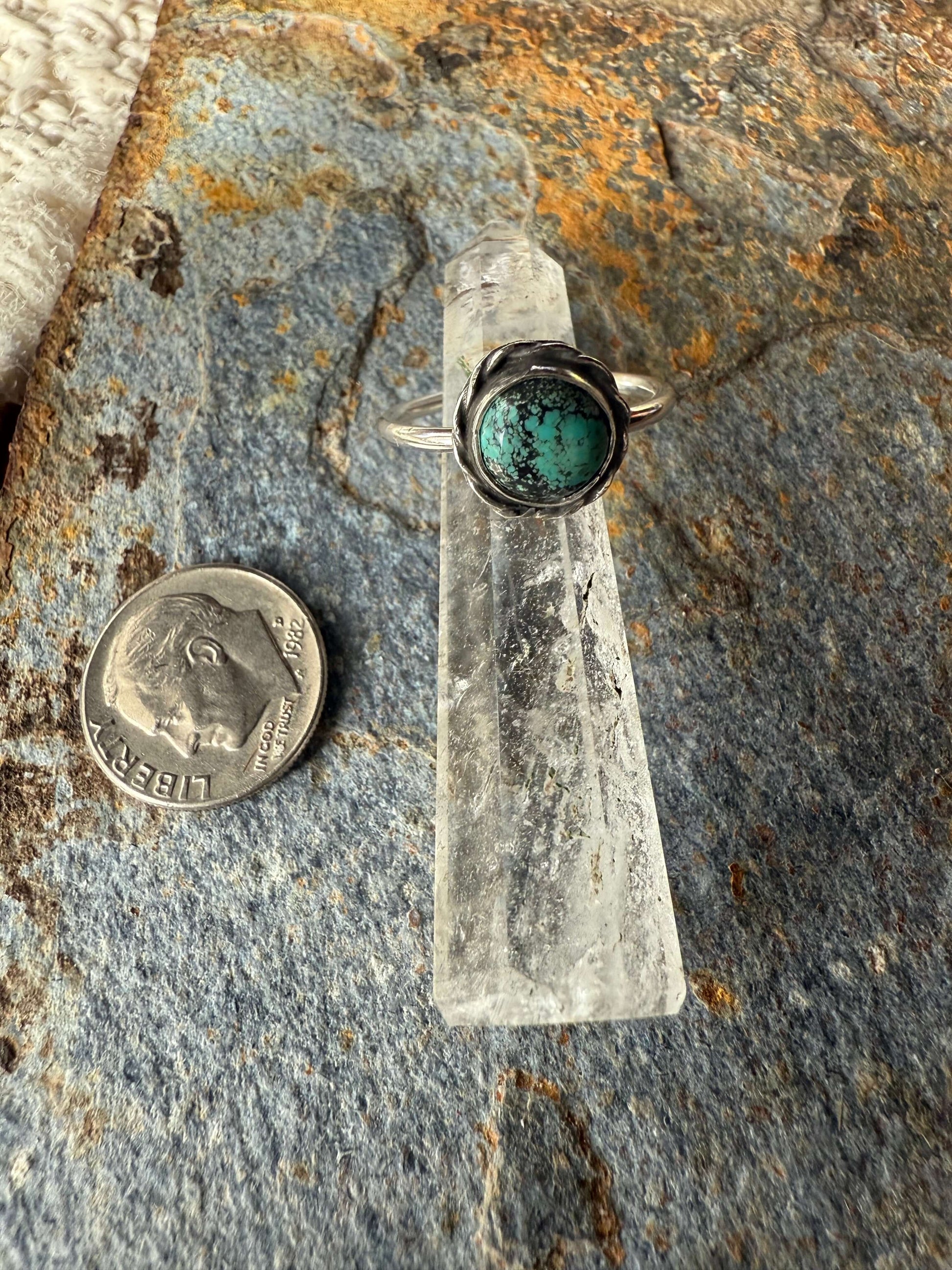Blue Moon Turquoise Sterling Silver Ring displayed next to a coin for size comparison.