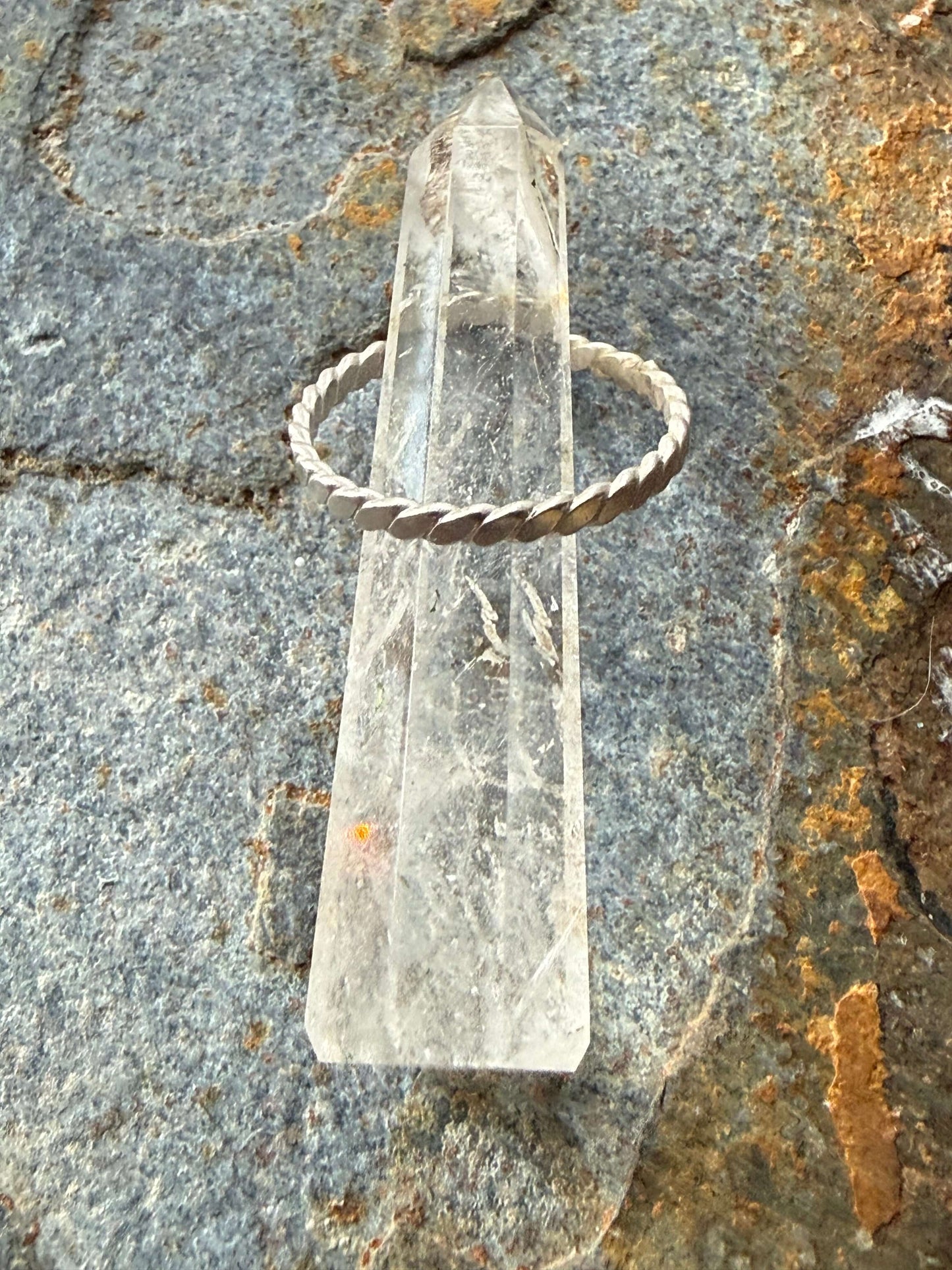 Clear crystal on a textured stone surface