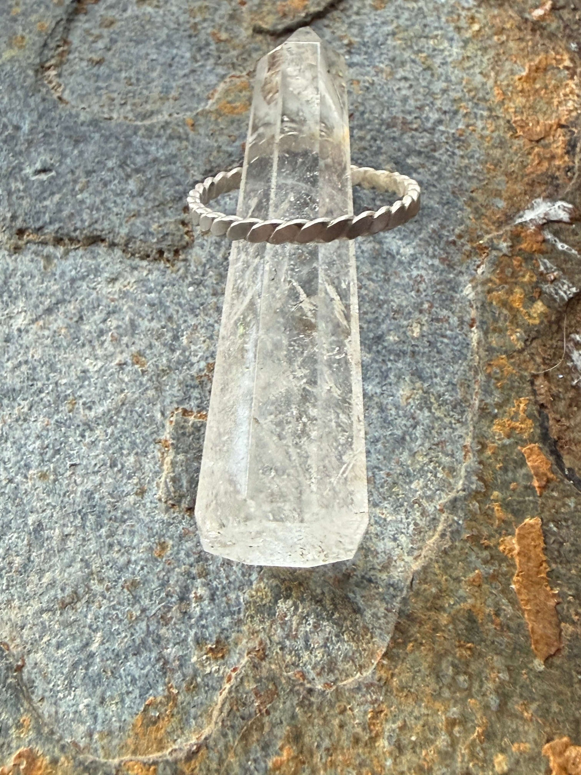 Clear crystal on a textured stone surface