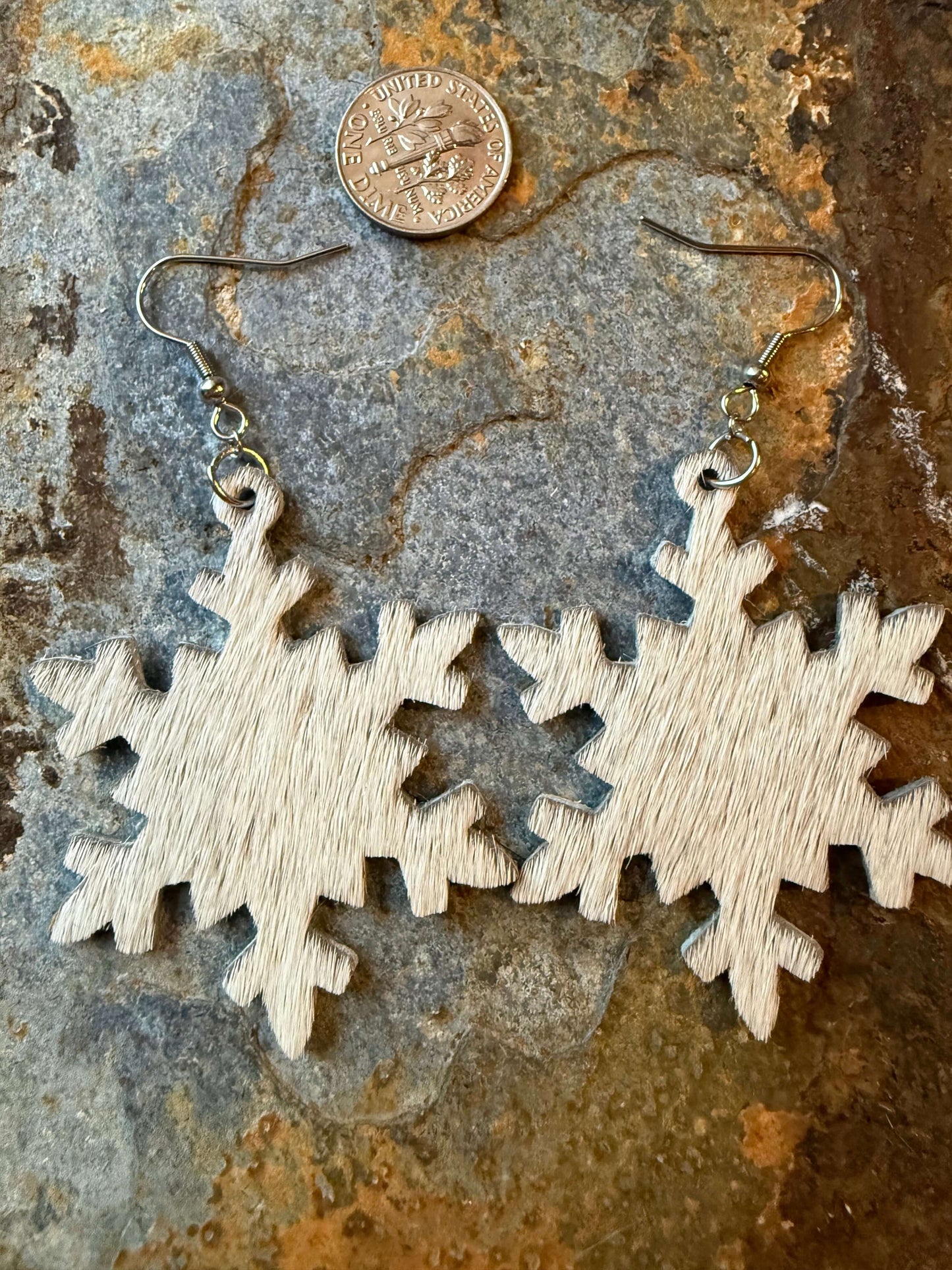 Cowhide Snowflake Earrings crafted from hair-on cowhide, showcasing rustic Western charm and boho elegance.